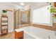 Bathroom featuring tile flooring, a glass shower, a bathtub, and a towel rack at 1561 Mosaic Way, Smyrna, GA 30080