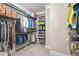 Walk-in closet with metal shelving and rods for hanging clothes and accessories at 1561 Mosaic Way, Smyrna, GA 30080