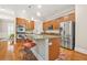 This kitchen features stainless steel appliances, a breakfast bar, and ample cabinet space at 1561 Mosaic Way, Smyrna, GA 30080