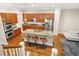 This kitchen features granite countertops, stainless steel appliances, and a breakfast bar at 1561 Mosaic Way, Smyrna, GA 30080