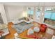 Sunlit living room featuring modern furnishings, hardwood floors, and an open layout at 1561 Mosaic Way, Smyrna, GA 30080