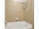 Shower in neutral tones includes tile surround, handheld shower head, and convenient soap dish at 1561 Mosaic Way, Smyrna, GA 30080