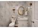 Charming powder room with patterned wallpaper, updated vanity, and modern fixtures at 1826 Bedfordshire Ct, Decatur, GA 30033