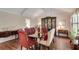 Formal dining room with hardwood floors, area rug, and classic furnishings at 1826 Bedfordshire Ct, Decatur, GA 30033