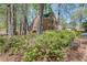 Charming brick home surrounded by lush greenery and trees, offering a serene setting at 1826 Bedfordshire Ct, Decatur, GA 30033