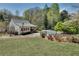 Charming home features a well-manicured lawn, fenced yard, and an inviting in-ground pool at 1826 Bedfordshire Ct, Decatur, GA 30033