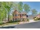 Traditional brick home with a manicured lawn, black shutters, and a welcoming front entrance at 1826 Bedfordshire Ct, Decatur, GA 30033