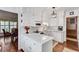 Bright kitchen with eat in kitchen, white cabinets, stainless appliances and hardwood floors at 1826 Bedfordshire Ct, Decatur, GA 30033