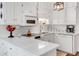 Bright kitchen with white cabinetry, sleek countertops, and modern stainless steel appliances at 1826 Bedfordshire Ct, Decatur, GA 30033
