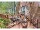Charming brick patio with outdoor seating, surrounded by lush greenery and access to the house at 1826 Bedfordshire Ct, Decatur, GA 30033