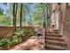 Inviting brick patio with seating area, framed by brick walls and landscaped with greenery at 1826 Bedfordshire Ct, Decatur, GA 30033