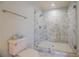 Contemporary shower design, featuring frameless glass and large, white marble-patterned tile at 3593 Hemphill St, Atlanta, GA 30337