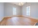 Bedroom featuring light blue walls, chandelier lighting and an outdoor balcony at 3593 Hemphill St, Atlanta, GA 30337