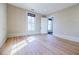 An empty bedroom that features hardwood floors and detailed wallpaper at 3593 Hemphill St, Atlanta, GA 30337