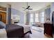Cozy bedroom features a fireplace, large windows, and natural light at 3593 Hemphill St, Atlanta, GA 30337