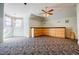 Bonus room with cabinets, carpet, and vintage windows at 3593 Hemphill St, Atlanta, GA 30337