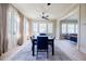 Dining room with a large table and natural light from big windows and french doors at 3593 Hemphill St, Atlanta, GA 30337