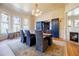 Elegant dining room featuring a large table, chandelier, and big windows with stained glass at 3593 Hemphill St, Atlanta, GA 30337