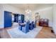 Bright dining room with chandelier, hardwood floors, and a glimpse into an adjacent sitting room at 3593 Hemphill St, Atlanta, GA 30337