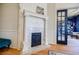 Close up of a beautiful fireplace featuring marble tile and carved woodwork, adding charm to the interior at 3593 Hemphill St, Atlanta, GA 30337