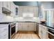 Well-equipped kitchen with stone countertops, stainless steel appliances, and ample cabinet space at 3593 Hemphill St, Atlanta, GA 30337