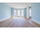 Bright living room featuring curved wall with stained glass windows and adjacent room access at 3593 Hemphill St, Atlanta, GA 30337