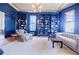 Sophisticated living room with custom bookshelves, statement lighting, and an abundance of natural light at 3593 Hemphill St, Atlanta, GA 30337