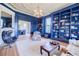Bright living room featuring a fireplace, custom bookshelves, designer furniture and an open layout at 3593 Hemphill St, Atlanta, GA 30337