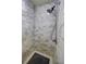 Modern tiled shower with upgraded shower head and integrated shelf at 3593 Hemphill St, Atlanta, GA 30337