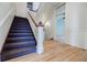 Traditional staircase with carpeted steps and hardwood landing at 3593 Hemphill St, Atlanta, GA 30337