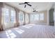 Bright sun room with large windows, hardwood floors, ceiling fans, and lots of natural light at 3593 Hemphill St, Atlanta, GA 30337