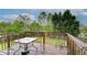 An outdoor wooden deck overlooking a peaceful backyard at 2121 Silva Ct, Conley, GA 30288
