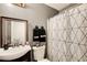 Bathroom featuring geometric shower curtain, modern fixtures, and dark wood vanity at 2121 Silva Ct, Conley, GA 30288