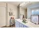Bright bathroom featuring double sinks with a large mirror, decorative accents, and updated fixtures at 2121 Silva Ct, Conley, GA 30288