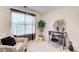 A cozy bedroom featuring a patterned chair and décor that adds style to the room at 2121 Silva Ct, Conley, GA 30288