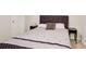 Bedroom showcasing stylish grey bedding with bedside tables at 2121 Silva Ct, Conley, GA 30288