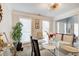 Formal dining room with modern chandelier, natural light and seating for six at 2121 Silva Ct, Conley, GA 30288