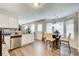 Bright eat-in kitchen with stainless steel appliances and granite countertops at 2121 Silva Ct, Conley, GA 30288