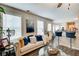 Comfortable living room featuring a sofa, bar stools, modern decor, and natural light at 2121 Silva Ct, Conley, GA 30288