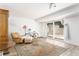 Finished basement featuring neutral colored walls and floors, area rug and sliding glass doors to the yard at 2590 Hawthorne Ne Pl, Atlanta, GA 30345