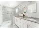 Bright bathroom features dual sinks, a glass enclosed shower, and modern fixtures at 2590 Hawthorne Ne Pl, Atlanta, GA 30345