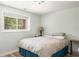 Bedroom with light green walls and natural light from the window at 2590 Hawthorne Ne Pl, Atlanta, GA 30345