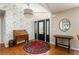 Entry foyer showcasing a hardwood floor, stylish wallpaper, and an elegant entry door at 2590 Hawthorne Ne Pl, Atlanta, GA 30345