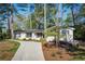 Home with a long driveway and lush landscaping and brick exterior at 2590 Hawthorne Ne Pl, Atlanta, GA 30345