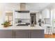 Bright kitchen features an island with a cooktop, white cabinets, and stainless steel appliances at 2590 Hawthorne Ne Pl, Atlanta, GA 30345