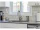 Kitchen sink with stainless steel faucet and soap dispenser with a backyard view at 2590 Hawthorne Ne Pl, Atlanta, GA 30345