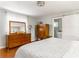 Light main bedroom with hardwood floors, a dresser, and ensuite bathroom with sliding barn door at 2590 Hawthorne Ne Pl, Atlanta, GA 30345