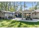 Backyard patio with outdoor seating, a grill, and lush green grass at 2590 Hawthorne Ne Pl, Atlanta, GA 30345