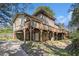 Two-story home with a large wooden deck on the 2nd story with access to the basement area at 2806 Chaucer Sw Dr, Atlanta, GA 30311