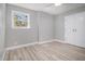 Neutral bedroom with closet, new floors, baseboards and natural light from a window at 2806 Chaucer Sw Dr, Atlanta, GA 30311